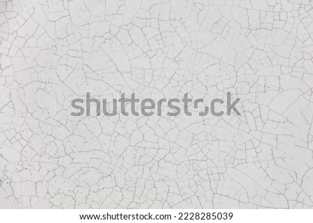 Cracked ceramic texture. Cracked white ceramic background. Royalty-Free Stock Photo #2228285039