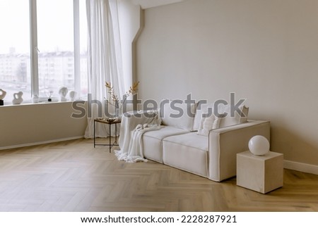 Stylish apartment interior. Beige wall color. Minimalism in design. Royalty-Free Stock Photo #2228287921