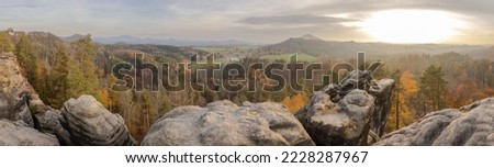 Panorama of the autumn hilly landscape in the Czech Switzerland National Park from the ruins of the rock castle