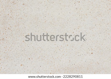 Beige ceramic background of plate. Royalty-Free Stock Photo #2228290811