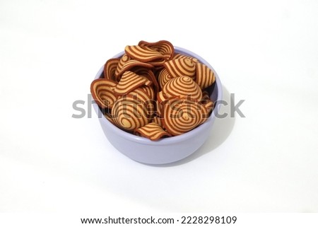 traditional Indonesian cakes called 'elephant ears' are suitable as snacks because they taste delicious. on a white background