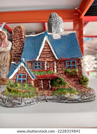 mini statue of skul and mummy and house