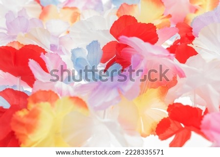 Colorful plastic hawaii flowers. Colorful background