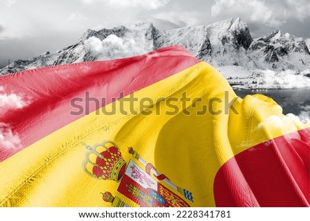 Spain national flag cloth fabric waving on beautiful Background.