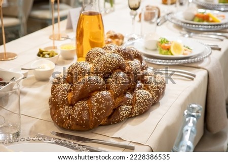 Jewish bread-challah for shabbat, wedding event. Orthodox Hasidic tradition food. Royalty-Free Stock Photo #2228386535