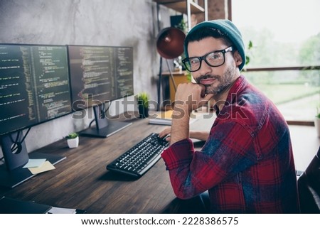 Photo of confident thoughtful guy dressed eyewear projecting game design modern device indoors workstation workshop home