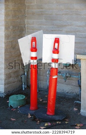 Traffic pylons stored in a building corner