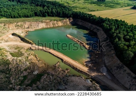 Flooded part of the sand pit, aerial view of the quarry pond