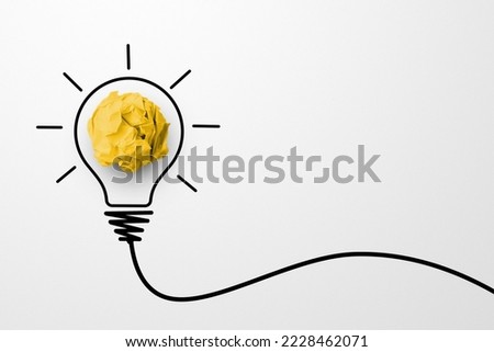 Creative thinking ideas and innovation concept. Paper scrap ball yellow colour with light bulb symbol on white background Royalty-Free Stock Photo #2228462071