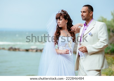 Beautiful loving couple bride and groom enjoying their wedding day outdoors in the park.