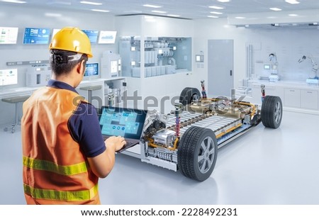 Asian engineer or technician work with ev car battery cells module in laboratory Royalty-Free Stock Photo #2228492231
