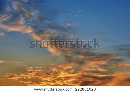 Sunset / sunrise with clouds on blue sky