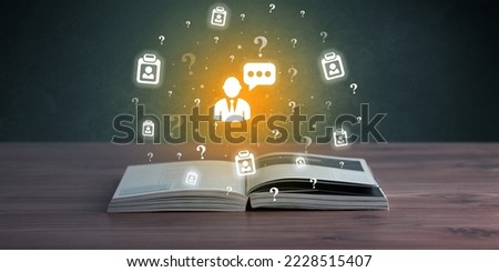 Open book with business icons above