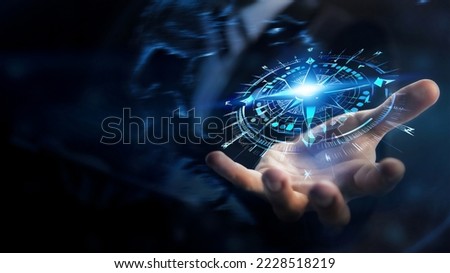 Concept of Strategic orientation in business or marketing. Purpose and direction in business. Compass in the hands of a businessman Royalty-Free Stock Photo #2228518219
