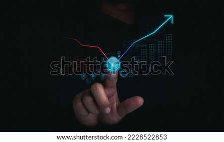 Investment technology, financial, return on investment - ROI concepts. Increasing arrow on digital tech chart and graph on dark background. Business growth, profit, solution, development and strategy. Royalty-Free Stock Photo #2228522853