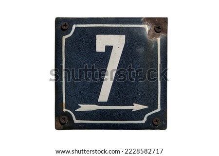 Weathered grunge square metal enameled plate of number of street address with number 7 isolated on white background