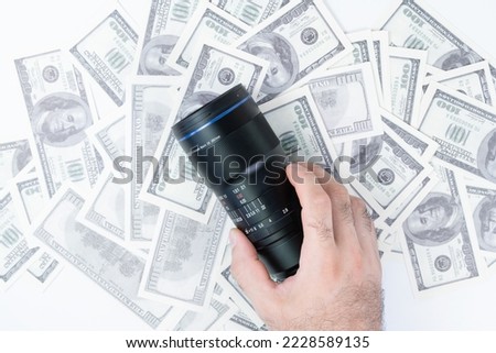 Buying a camera lens for money