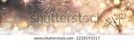 2023 New Year Celebration - Golden Clock And Fireworks At Eve Night In Abstract Defocused Lights Royalty-Free Stock Photo #2228593317