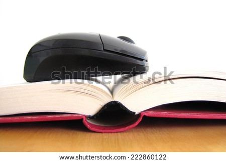 Concept of ebook. Book and mouse