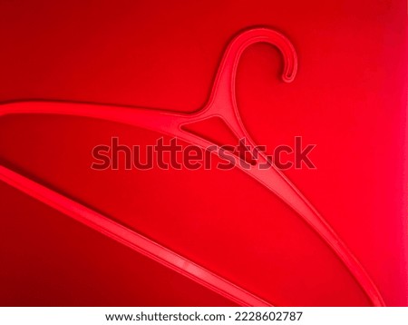 red hanger insulated with red background
