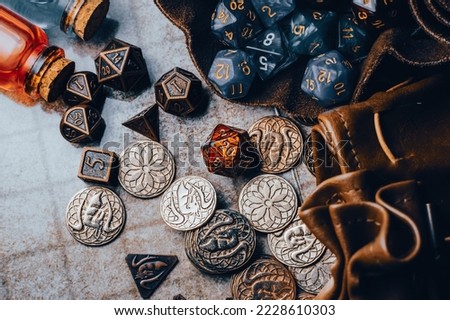 Overhead view of table top role-playing gaming equipment. Royalty-Free Stock Photo #2228610303