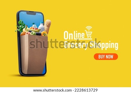 Online grocery shopping and home delivery: bag full of groceries coming out of a smartphone screen Royalty-Free Stock Photo #2228613729