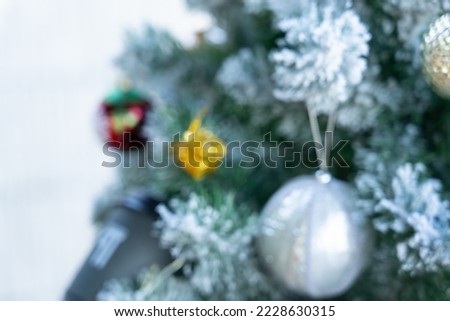 Defocused Picture of Christamas Tree decorated with Ornaments for Celebration in Christmas Festival