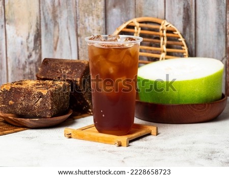 winter melon tea served in disposable cup isolated on table side view taiwan style Royalty-Free Stock Photo #2228658723