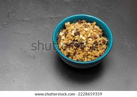 Healthy homemade muesli in a blue bowl