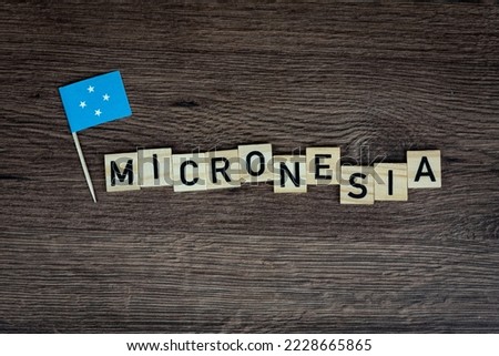 Micronesia - wooden word with micronesia flag (wooden letters, wooden sign)