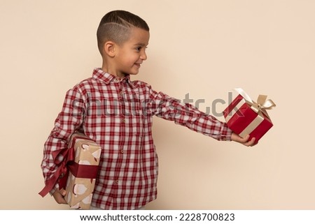 Cute little boy with presents.