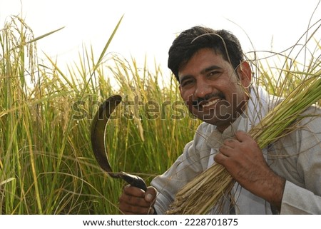 Portrait of an Indian farmer doing cultivation at agriculture field