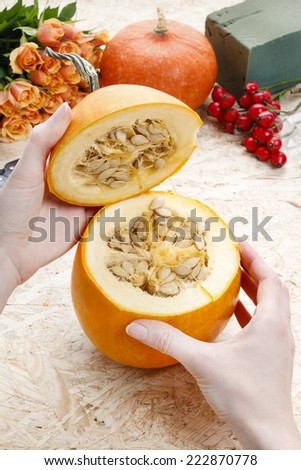 How to make a Thanksgiving centerpiece - step by step: removing the loose pulp and seeds from the pumpkin.