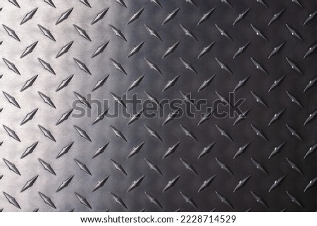 Dark metal texture with a corrugated print. iron plate background