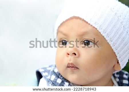 baby waking up after a good night sleep with people stock photo