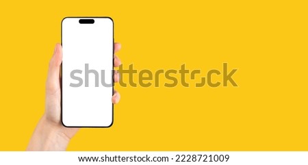 Phone mock up frame in hand on yellow ad banner, promo background for app ads. High quality photo