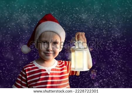 Cute boy holding a lantern, standing in the snow, on the street, a magical Christmas picture