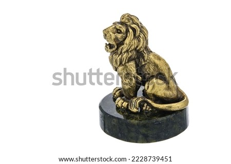 Lion Vintage Antique grunge bronze brass figurine statue of beautiful animal on stone, isolated on white background. Decoration Sculpture for interior. Close up Selective soft focus.