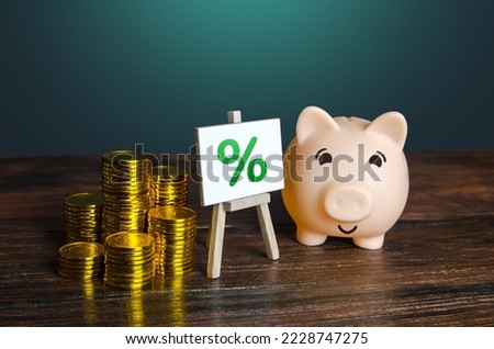 Piggy bank with money and percentage sign. Loan interest rate. Cashback shopping bonus. Return on investment ROI. Favorable offers of deposits by banks. High profitability. Saving money.