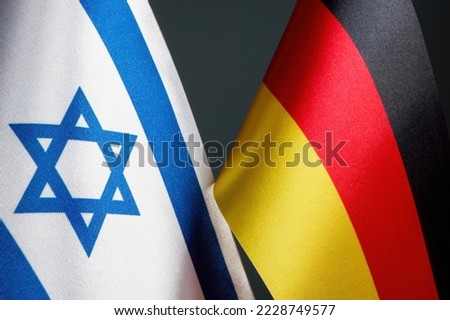 Flags of Germany and Israel as a symbol of diplomatic relations. Royalty-Free Stock Photo #2228749577