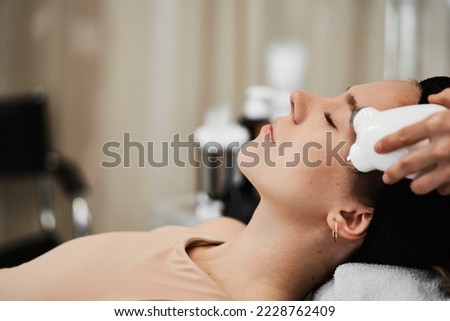 Women's face massage with gadgets. High quality photo