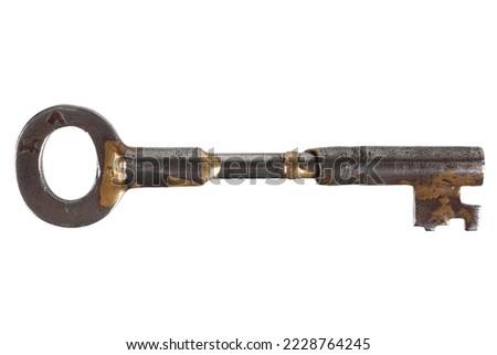 Old rusty key on a white background.