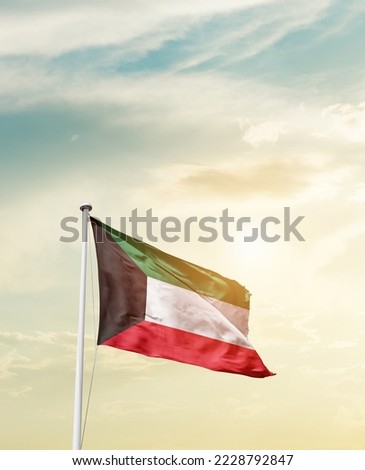Kuwait national flag waving in beautiful sky. Royalty-Free Stock Photo #2228792847