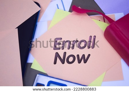 Enroll Now. Text on adhesive note paper. Event, celebration reminder message.