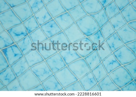 Swimming pool bottom caustics ripple and flow with waves background and Summer background