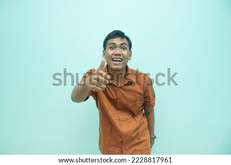 southeast asian male model with top hand gesture