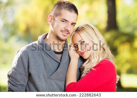 Portrait of young couple in autumn park