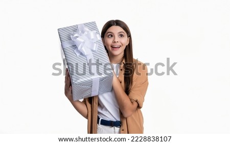 photo of surprised teen girl hold birthday gift. teen girl with birthday gift isolated on white