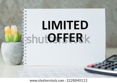 Limited offer text on a notepad on the table, business concept