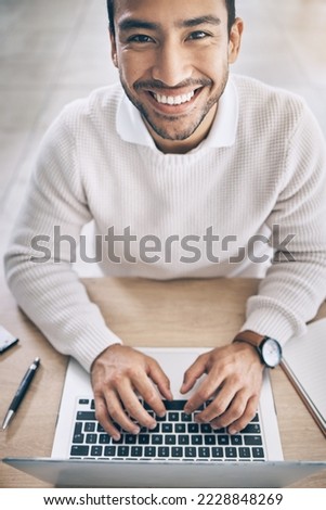 Laptop, portrait and asian businessman at desk for startup career in copywriting, digital marketing and online research. Planning, working and young business man with inspiration, ideas and happy job
